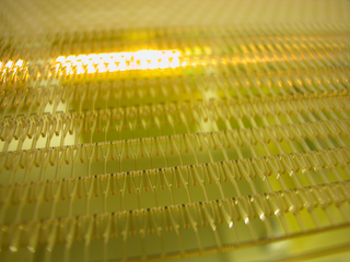 Fully-populated wafer with 500µm deep cavities, ready for electroforming.